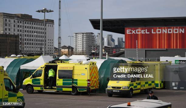 London Ambulance vehicles are seen outside the ExCeL London exhibition centre in London on April 1 which has been transformed into the NHS...