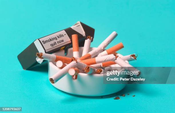 smoking kills, broken cigarettes in ashtray - cigarette pack stock pictures, royalty-free photos & images