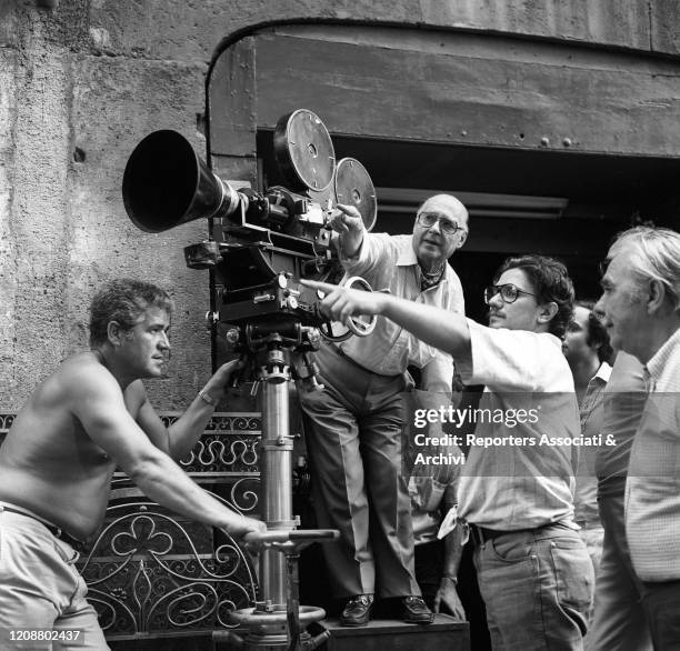 Italian director Roberto Rossellini preparing a scene on the set of Year One. 1974