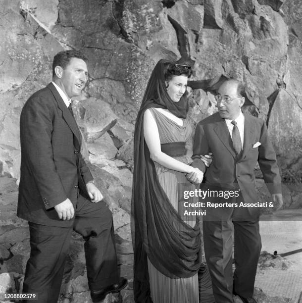 Italian director Mario Camerini talking to Italian actress Silvana Mangano, as Penelope, on the set of the film Ulysses. 1953