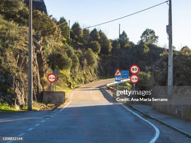 road with traffic signs and entrance sign to spain from portugal to the province of salamanca - ireland border stock pictures, royalty-free photos & images