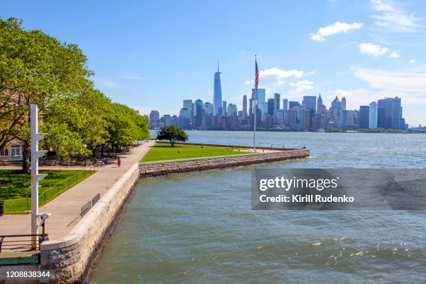 a view of downtown manhattan with the liberty island in foreground, new york, usa - brookfield place stock pictures, royalty-free photos & images