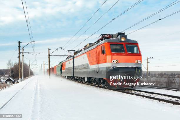 powerful electric locomotive leads freight train - russia train stock pictures, royalty-free photos & images