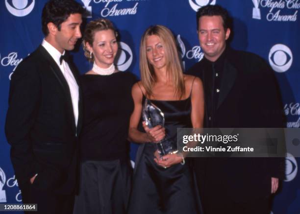 David Schwimmer, Lisa Kudrow, Jennifer Aniston and Matthew Perry of the television show "Friends" pose with their People's Choice Award backstage on...