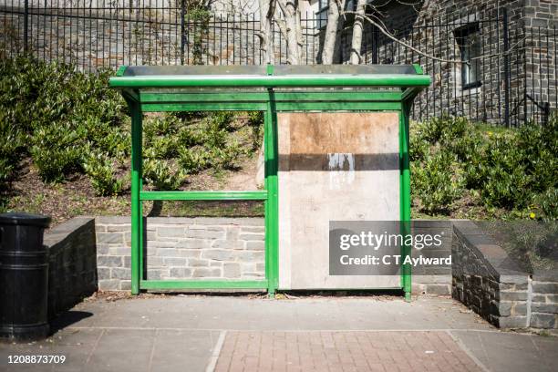 vandalised bus stop - bus shelter ストックフォトと画像