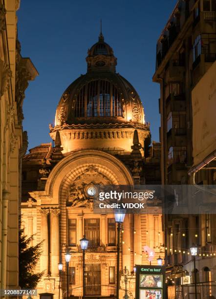view of the cec palace from a narrow street in bucharest, romania. - bucharest stock pictures, royalty-free photos & images