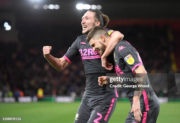 Mateusz Klich of Leeds United celebrates with Luke Ayling after scoring his team's first goal during the Sky Bet Championship match between...