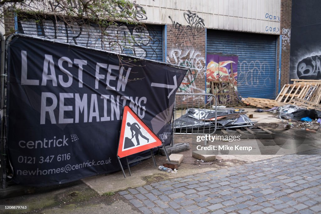 Remaining Sign Last few remaining flats for sale sign beside a derelict building in ...