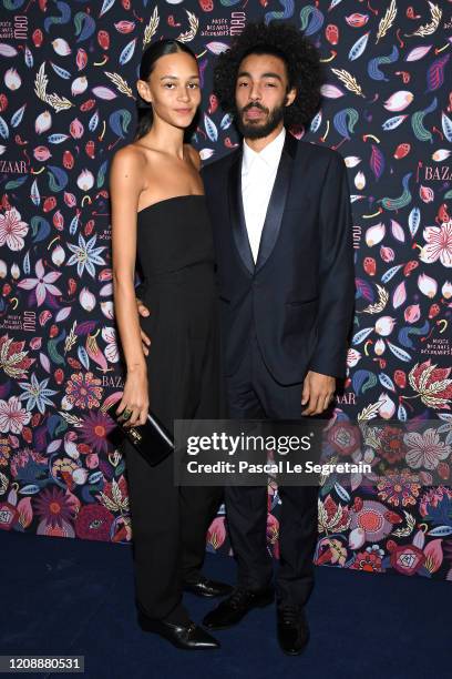 Guest and Binx Walton attend the Harper's Bazaar Exhibition as part of the Paris Fashion Week Womenswear Fall/Winter 2020/2021 At Musee Des Arts...