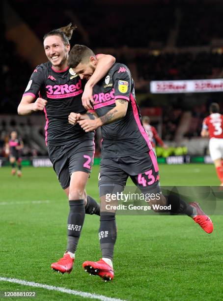 Mateusz Klich of Leeds United celebrates with Luke Ayling after scoring his team's first goal during the Sky Bet Championship match between...