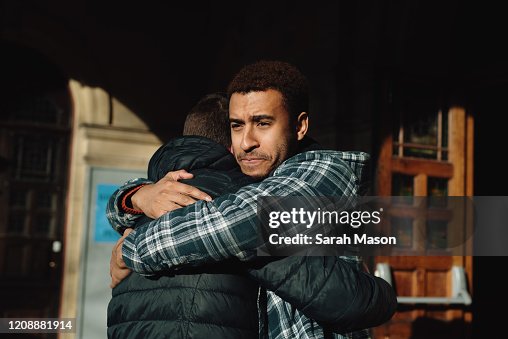 Two men hugging Two men hugging