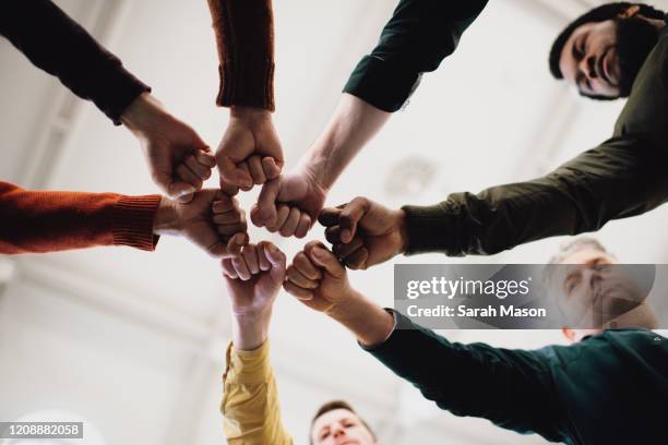 Fists Fists Circle Photos and Premium High Res Pictures - Getty Images