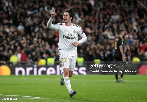 Isco of Real Madrid celebrates after scoring his team's first goal during the UEFA Champions League round of 16 first leg match between Real Madrid...