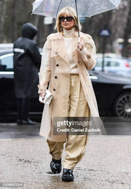 Xenia Adonts is seen wearing a Margiela outfit outside the Maison Margiela show during Paris Fashion Week: AW20 on February 26, 2020 in Paris, France.