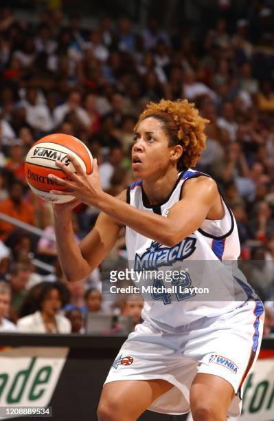 Nykesha Sales of the Orlando Miracle shoots free throws during the WNBA All-Star game on July 15, 2002 at the MCI Center in Washington DC. NOTE TO...
