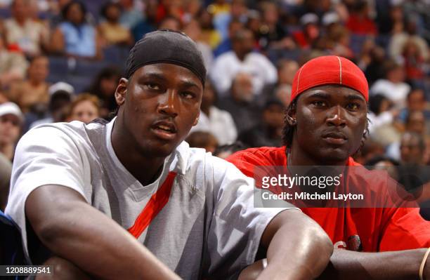 Kwame Brown of the Washington Wizards sits courtside during the WNBA All-Star game on July 15, 2002 at the MCI Center in Washington DC. NOTE TO USER:...