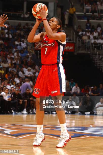 Tina Thompson of the Houston Comets shoots three point basket during the WNBA All-Star game on July 15, 2002 at the MCI Center in Washington DC. NOTE...
