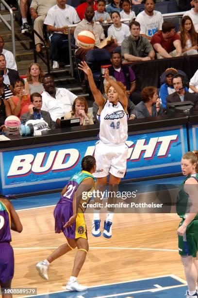 Nykesha Sales of the Orlando Miracle shoots three point basket during the 2002 WNBA All-Star Game on July 15, 2002 at the MCI Center in Washington,...