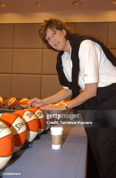 Head Coach Anne Donovan of the Seattle Storm autographs basketballs as she arrives for the 2005 WNBA All-Star game on July 8, 2005 at Mohegan Sun...