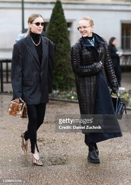 Pernille Teisbaek and Alexandra Carl are seen outside the Maison Margiela show during Paris Fashion Week: AW20 on February 26, 2020 in Paris, France.