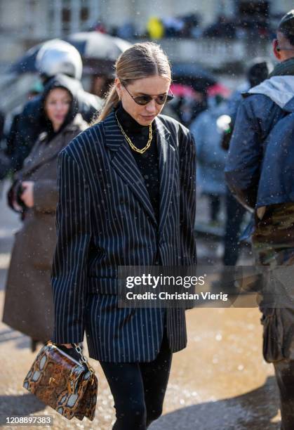 Pernille Teisbaek seen wearing striped blazer, brown bag with snake print outside Maison Margiela during Paris Fashion Week - Womenswear Fall/Winter...