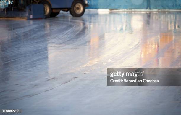 resurfacing machine cleaning ice, background ice rink. - empty ice rink stock pictures, royalty-free photos & images