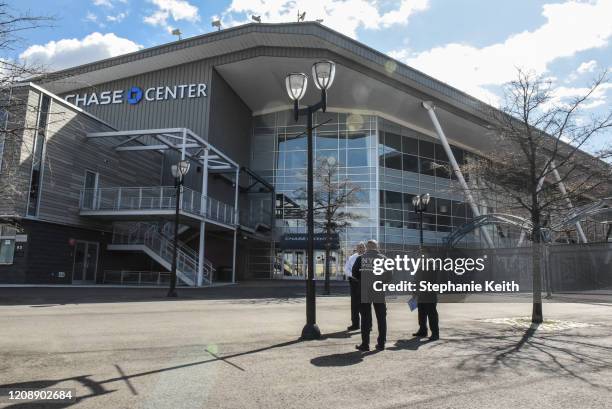 Members of the New York City Police Department stand in front of the Billie Jean King National Tennis Center in Flushing Meadows Park on April 1,...