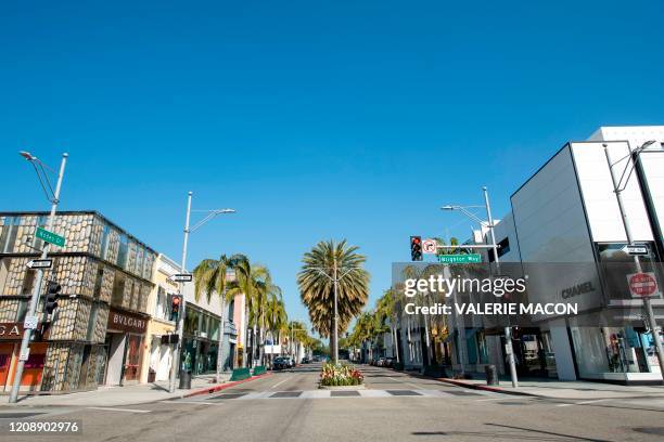 View of a deserted Rodeo Drive in Beverly Hills, California on April 1, 2020 during the Covid 19 crisis. - All 40 million residents of California...