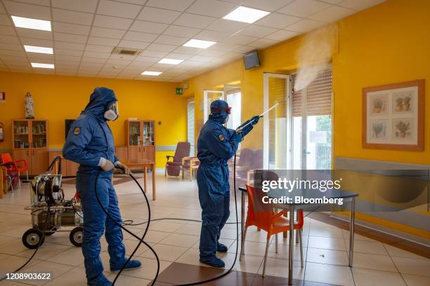 Soldiers from the Russian military disinfect a common room during their full disinfection of the Foundation of Ponte S. Pietro nursing home in Ponte...