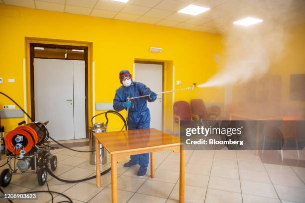 Soldiers from the Russian military disinfect a common room during their full disinfection of the Foundation of Ponte S. Pietro nursing home in Ponte...