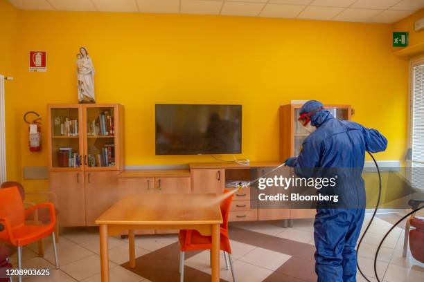 Soldiers from the Russian military disinfect a common room during their full disinfection of the Foundation of Ponte S. Pietro nursing home in Ponte...