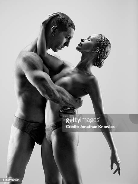 female and male in paint posing - frau in slip stock-fotos und bilder