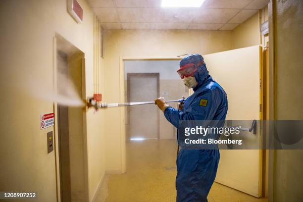 Soldier from the Russian military disinfects an elevator during their full disinfection of the Foundation of Ponte S. Pietro nursing home in Ponte...