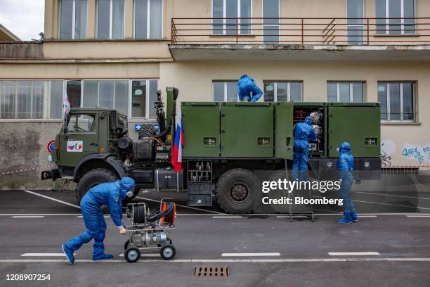 Soldiers from the Russian military pack equipment following their full disinfection of the Foundation of Ponte S. Pietro nursing home in Ponte San...