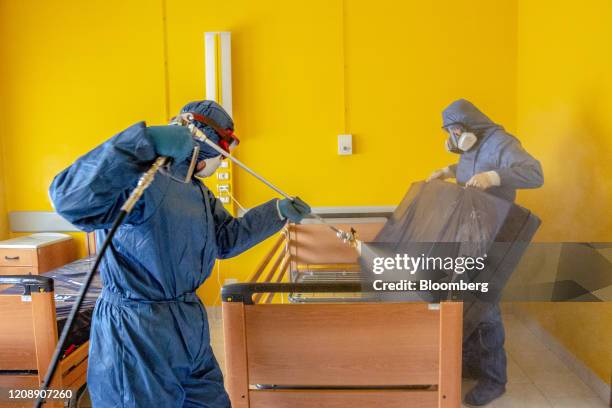 Soldiers from the Russian military disinfect the underside of a mattress during their full disinfection of the Foundation of Ponte S. Pietro nursing...