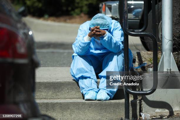 Sad and tired healthcare worker is seen by the Brooklyn Hospital Center in New York, United States on April 1, 2020. New York is the U.S. State...