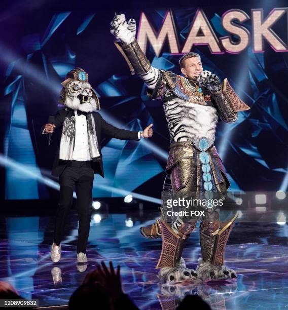 : Host Nick Cannon and Rob Gronkowski in The Super Nine Masked Singer Special: Groups A, B & C special two-hour episode of THE MASKED SINGER airing...