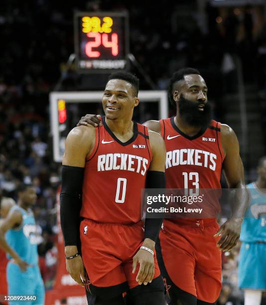 Russell Westbrook of the Houston Rockets is calmed down by James Harden after a technical foul was called on him during the second quarter against...