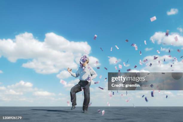 gelukkige oudste met wolken van geld - man flying stockfoto's en -beelden