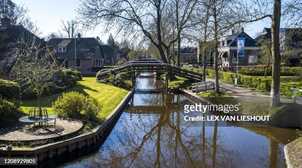 Picture taken on March 31, 2020 shows empty streets in Giethoorn, as the country is under lockdown to stop the spread of the Covid-19 pandemic caused...