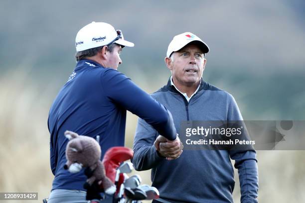 Ryan Fox of New Zealand shakes hands with his caddie Steve Williams during day one of the 2020 New Zealand Golf Open at The Hills on February 27,...