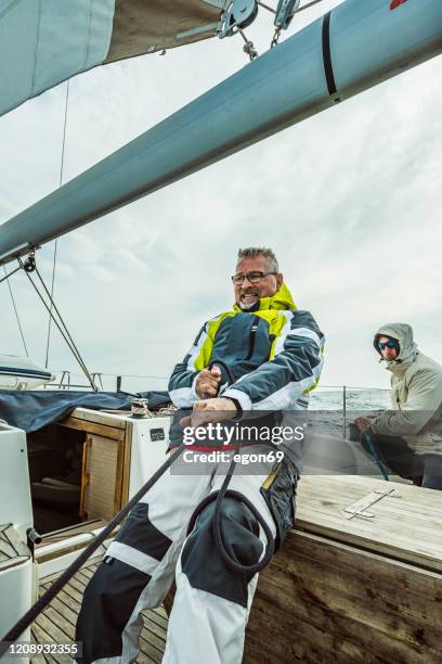 adventure friends on the sailing boat - sailing competition stock pictures, royalty-free photos & images