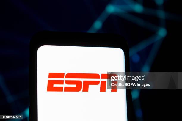 In this photo illustration an ESPN logo seen displayed on a smartphone.