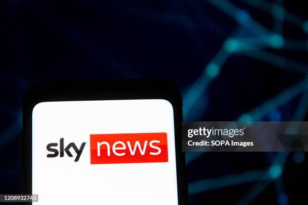 In this photo illustration a Sky News logo seen displayed on a smartphone.