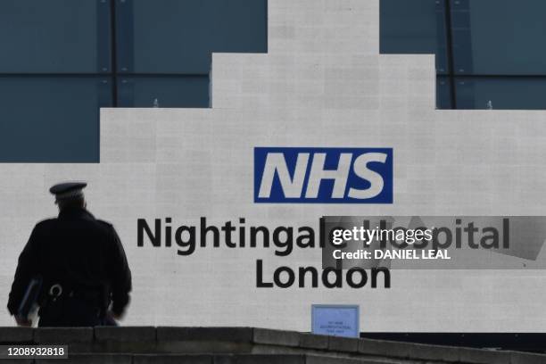Man walks at the NHS Nightingale Hospital on the site of the ExCeL London exhibition centre in London on April 2 which is operating as a field...