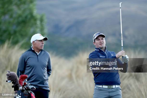 Ryan Fox of New Zealand warms up with his caddie Steve Williams during day one of the 2020 New Zealand Golf Open at The Hills on February 27, 2020 in...