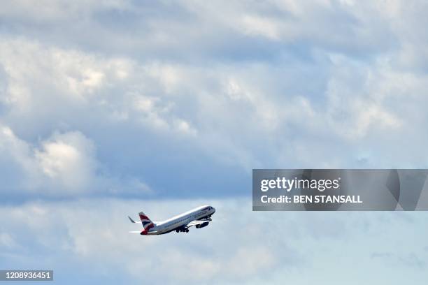 British Airways passenger aircraft takes off from Heathrow Airport, west of London on April 2 as life in Britain continues during the nationwide...