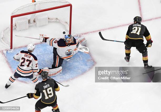 Nick Cousins of the Vegas Golden Knights scores a third-period power-play goal against Mikko Koskinen of the Edmonton Oilers during their game at...