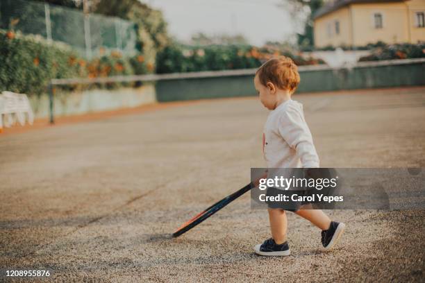 toddler playing tennis - 3 liga stock-fotos und bilder