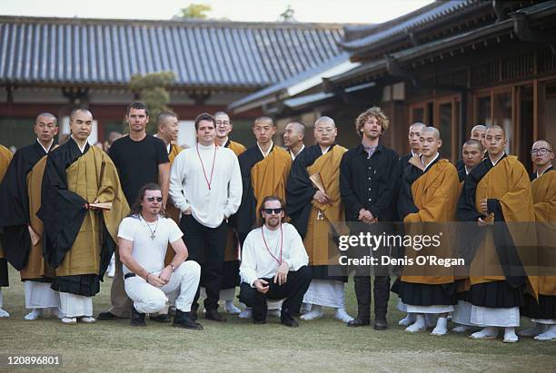 Singer Michael Hutchence with other members of Australian rock group INXS and a group of monks, at the Todai-ji temple in Nara, Japan, May 1994. INXS...